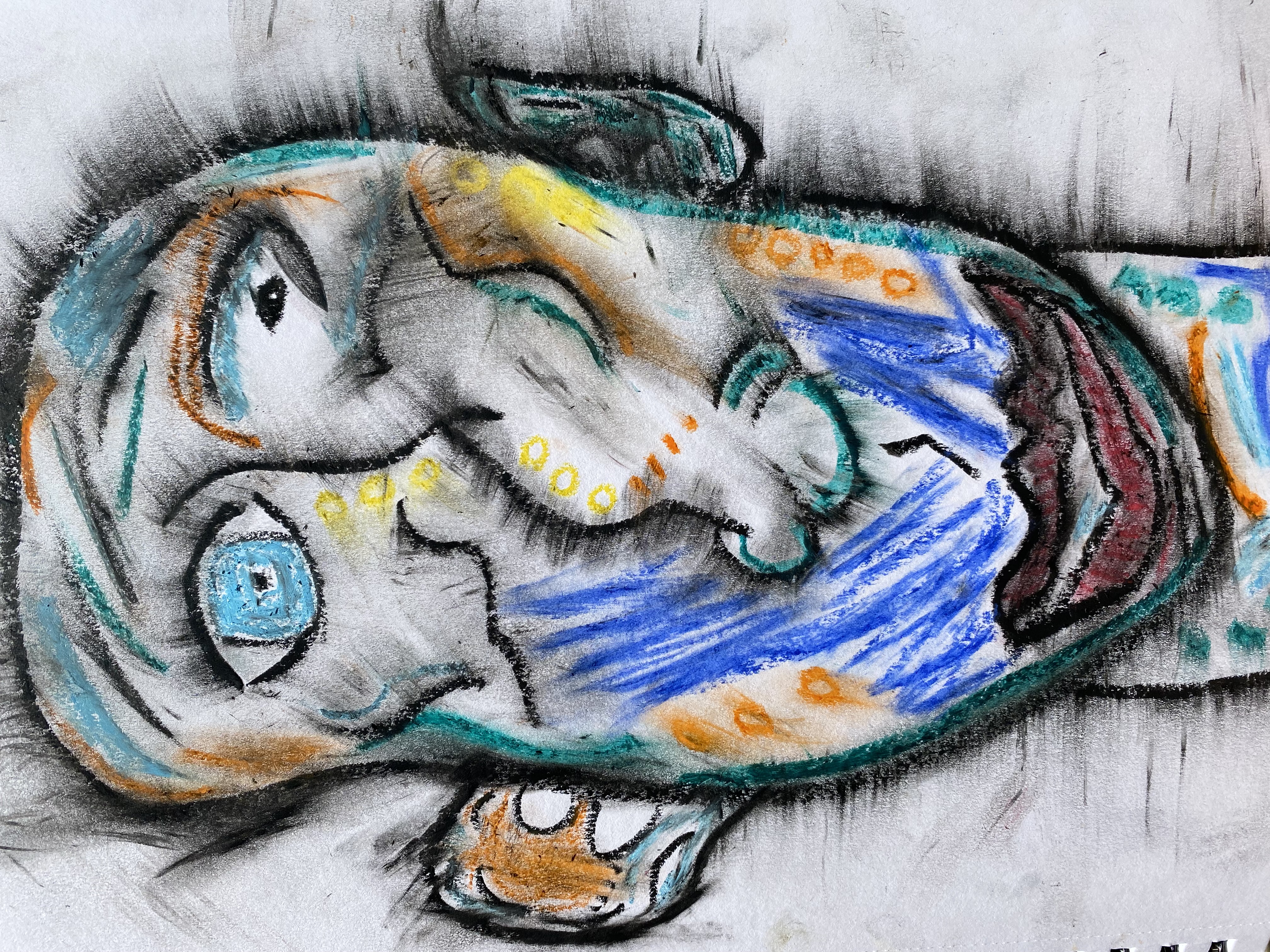 abstract sketch of a face made with the artist loft's oil pastels. colors include: orange, teal blue, black, light blue, yellow, and red.
