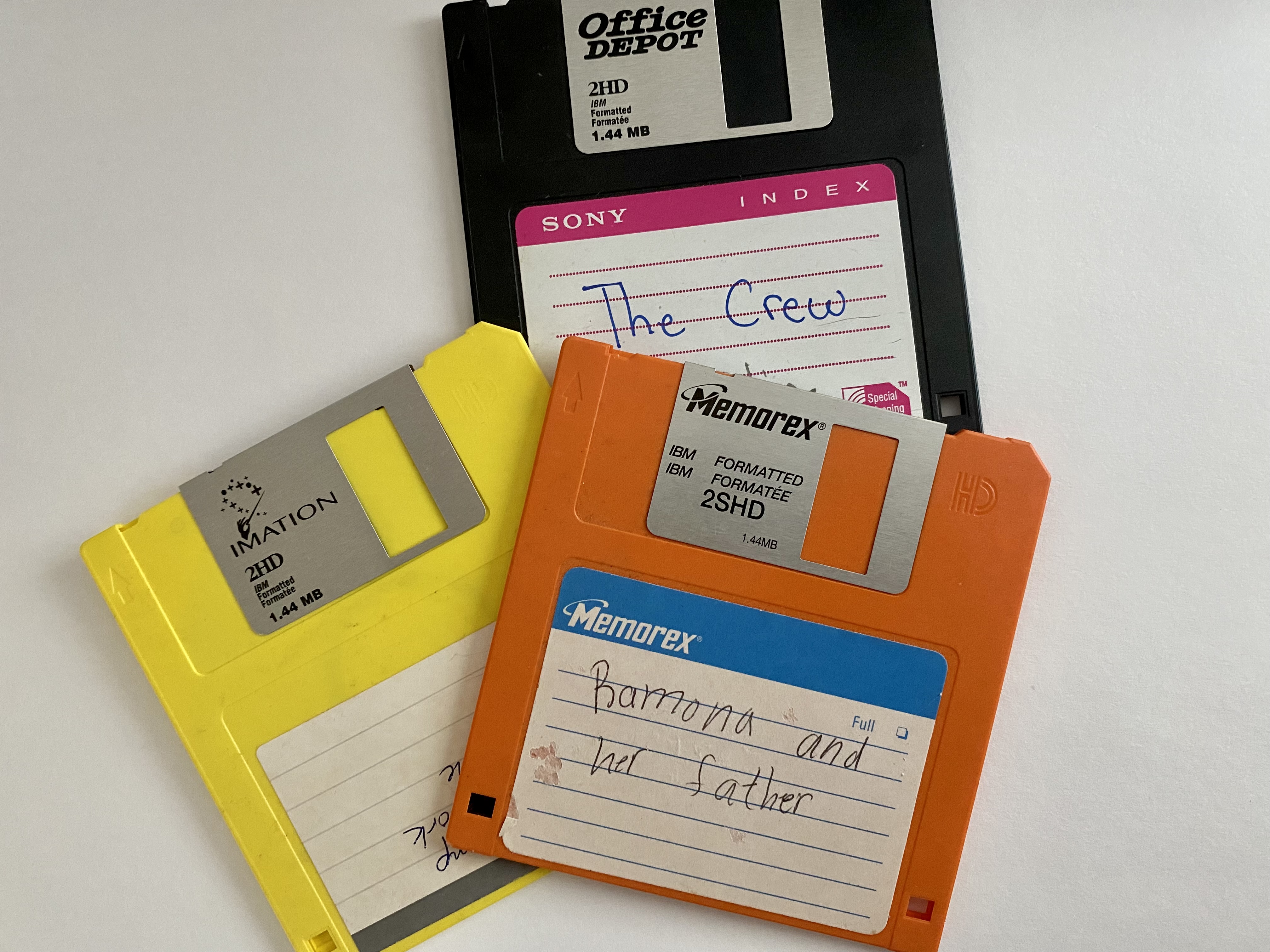 three IBM floppy disks with white background. relicts of the past.