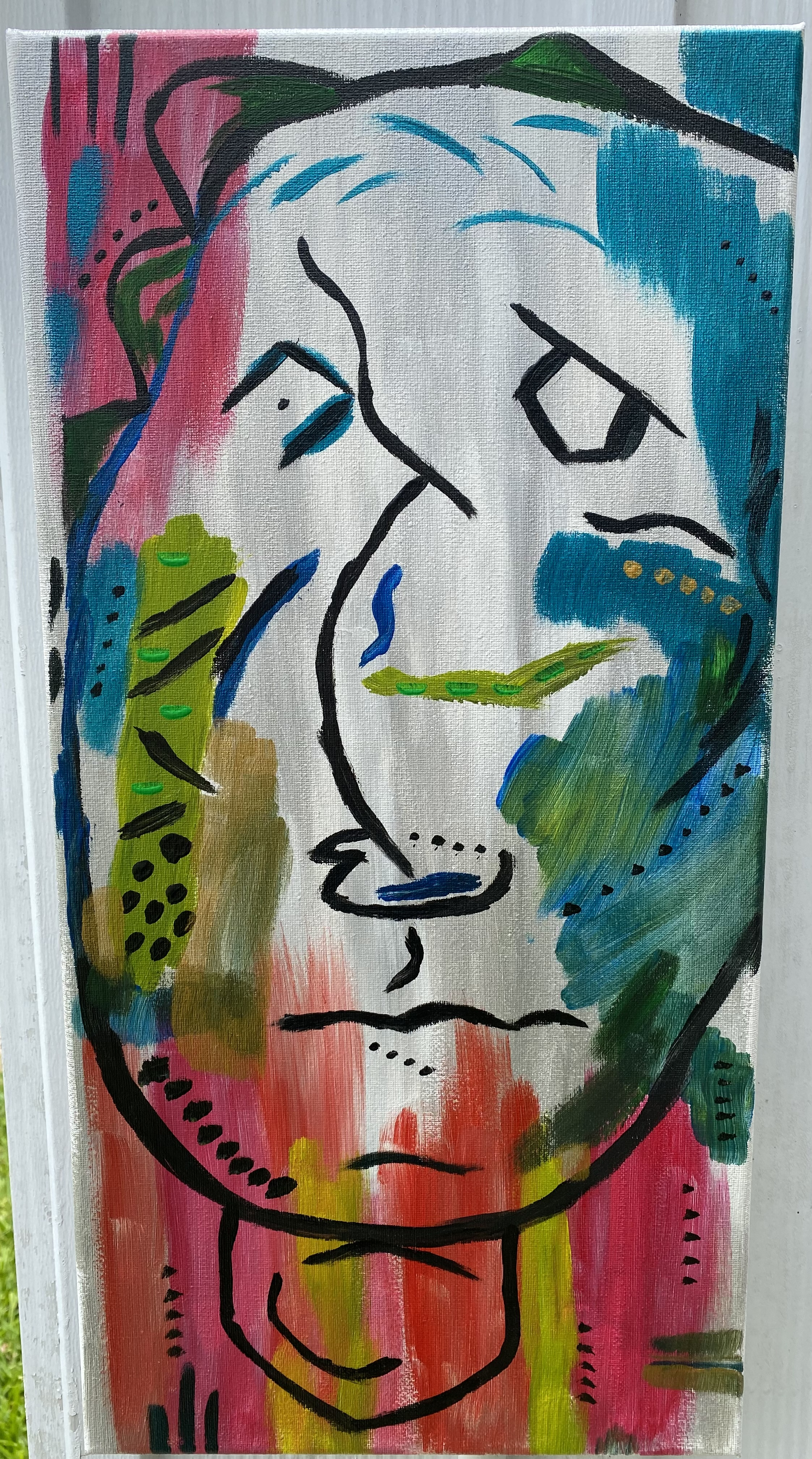 10in x 20in canvas with abstract face. silver and white prime the painting. brilliant pink, yellow, and red brush strokes come up from the lower section. hues of blue, green, yellow, and dark green are scattered throughtout the painting. three black lines appear in the upper left hand corner and the lower left hand corner.